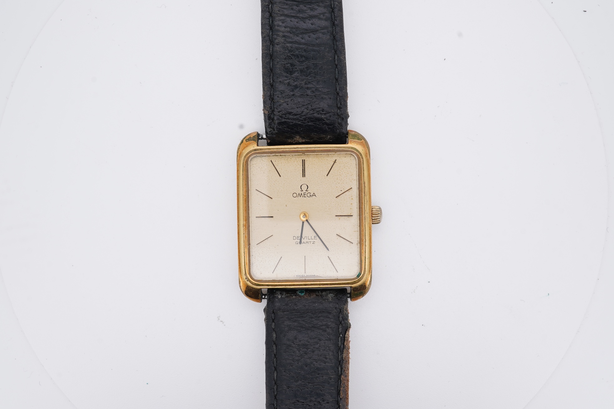 A gentleman's late 1970's steel and gold plated Omega De Ville quartz wrist watch, with rectangular dial and baton numerals, movement c.1330, case diameter 30mm, no buckle, box or papers.